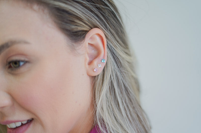 Square shaped zirconia set in iconic solitaire.